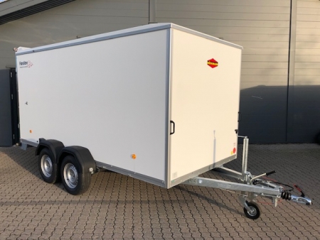Eight shirts arranged on table in black, olive, grey, blue, white, red, mustard, and green.