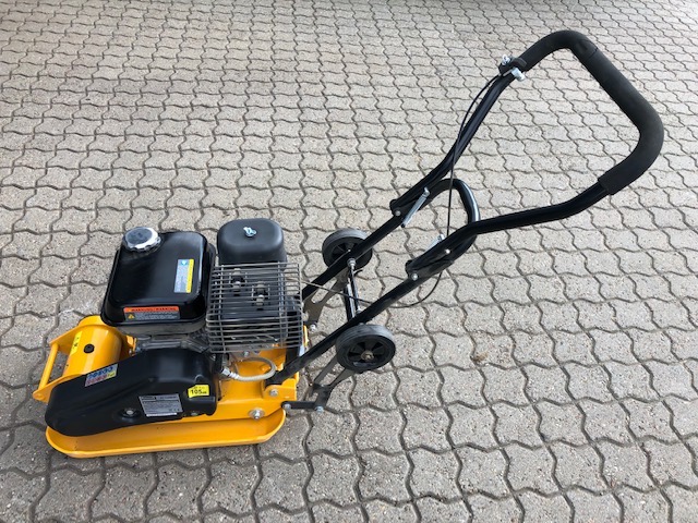 Eight shirts arranged on table in black, olive, grey, blue, white, red, mustard, and green.