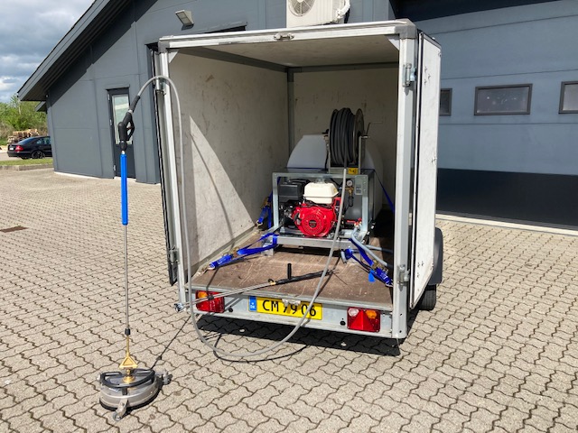 Eight shirts arranged on table in black, olive, grey, blue, white, red, mustard, and green.